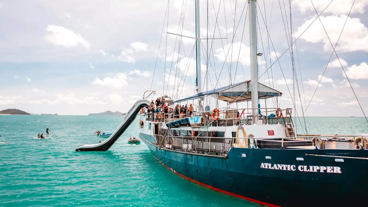 Photo of the side of the Atlantic Clipper boat while travellers are having fun